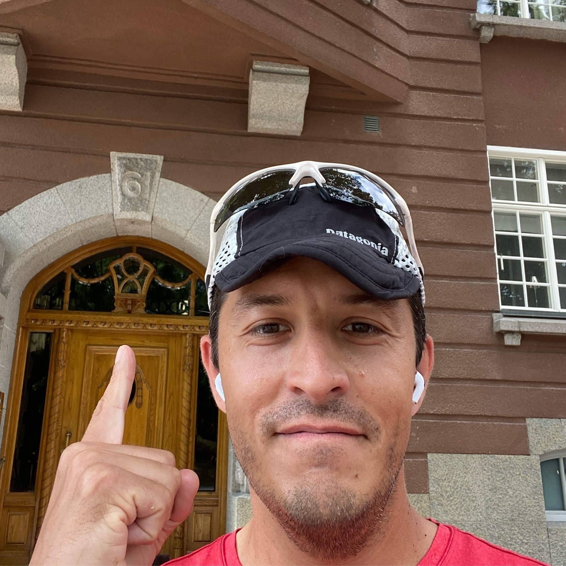 selfie of Aaron in front of building where he lived