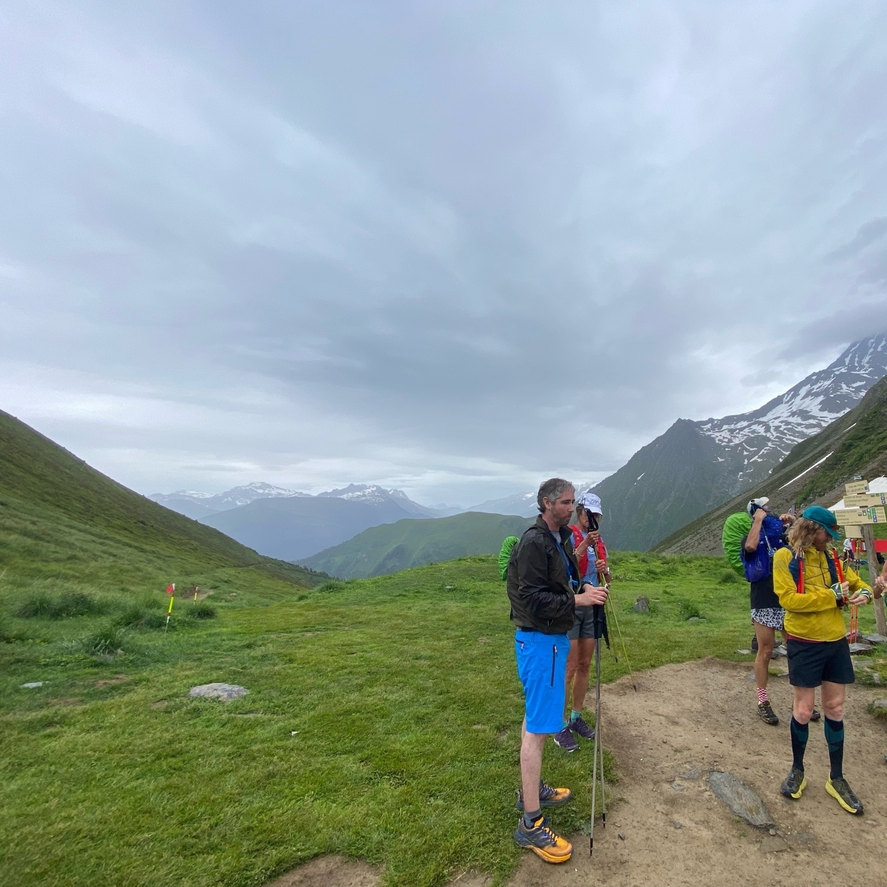 runners in the French alps on a mountain pass. 