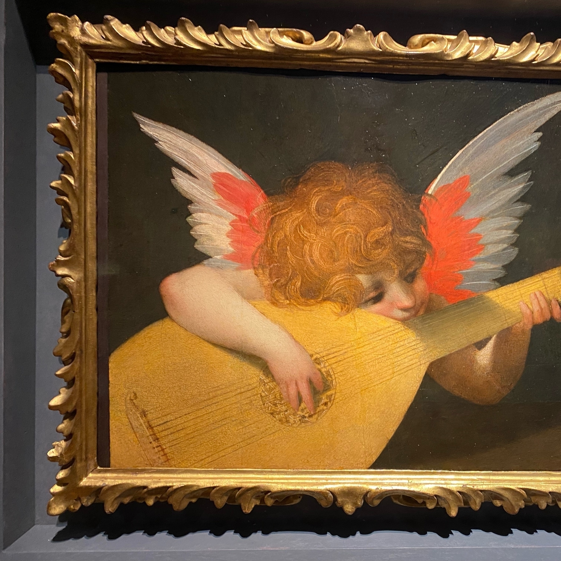 painting of putto playing a lute